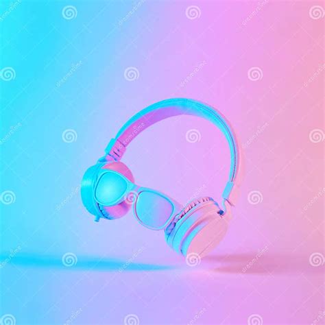 Creative Layout Made Of Headphones With Sunglasses In Vibrant Gradient