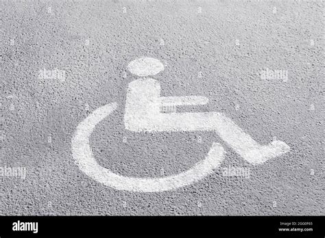 Symbol of handicapped on parking place Stock Photo - Alamy