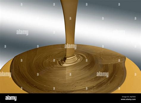 Pouring Liquid Gold Stock Photo Alamy