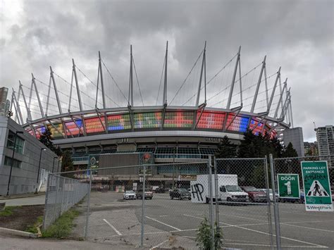 Inside of local stadium being lit with world flags. : vexillology