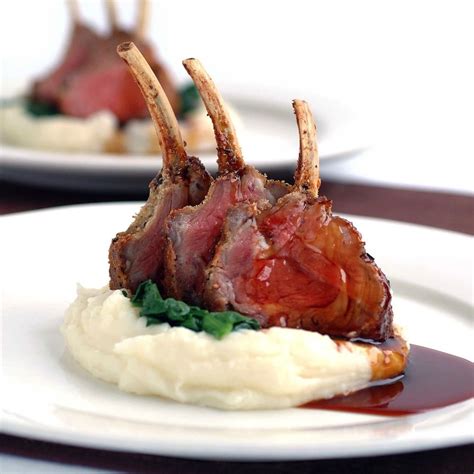 Rosemary And Parmesan Crusted Lamb Racks With Mash Potato And Red Wine Jus