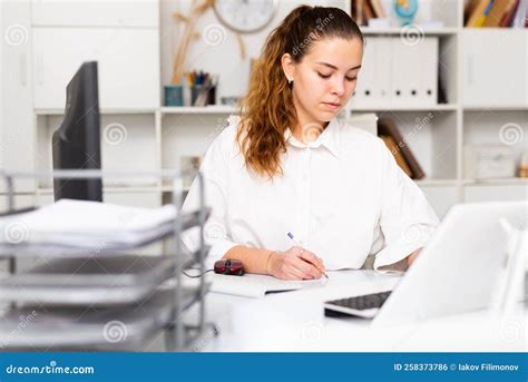 Portrait Of Young Female Office Worker Stock Photo Image Of Focusing