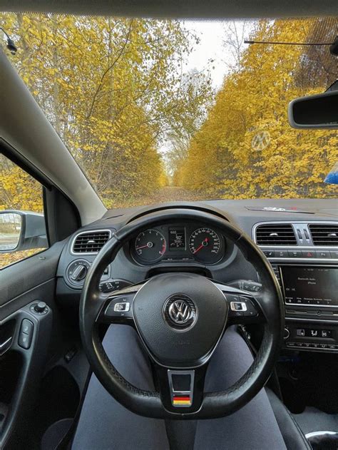 The Interior Of A Car With Dashboard And Steering Wheel View From