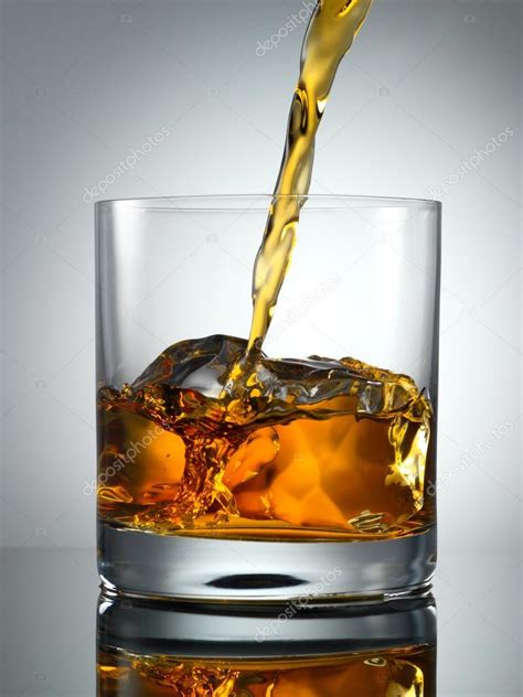 Pouring Scotch Whisky In Glass With Perfect Ice Stock Photo By Smaglov