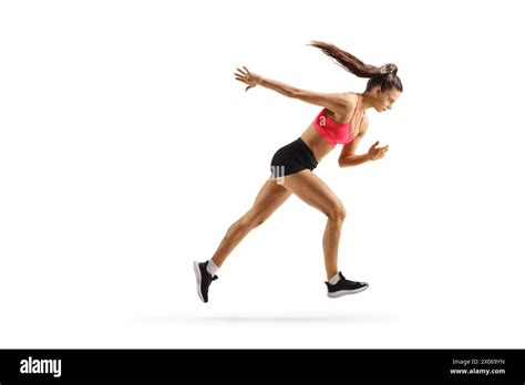 Full Length Profile Shot Of A Young Female Athlete Running Isolated On