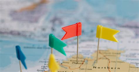 Tiny Colorful Flags on a Map · Free Stock Photo