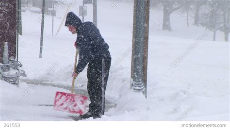 Man Shoveling Snow 02 Stock Video Footage 261553