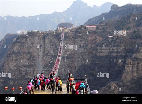 Tourists Throng To Walk On The Worlds Longest Glass Bridge In The