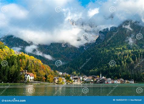 Panoramic View Of The Lago Di Alleghe Lake In The Italian Dolomites