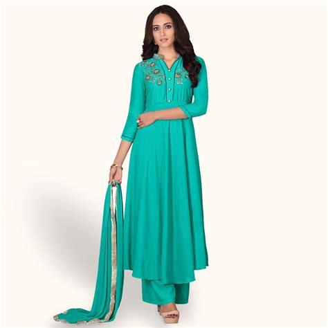 Blissful Turquoise Colored Partywear Embroidered Cotton Palazzo Suit