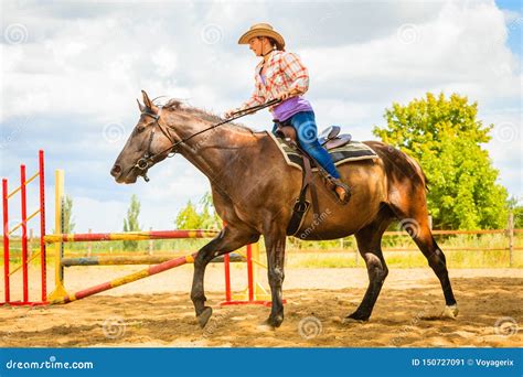 Cowgirl In Western Hat Doing Horse Jumping Stock Image Image Of