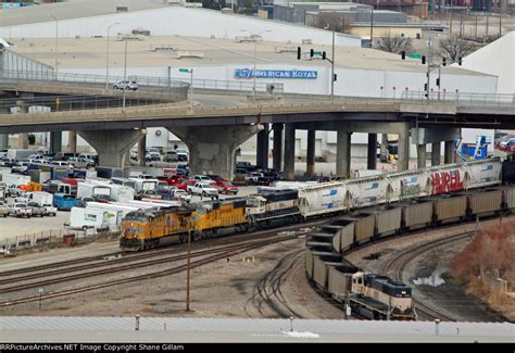 UP 7657 Rolls A SB BNSF Freight While The Dpu On A Empty Coal Train