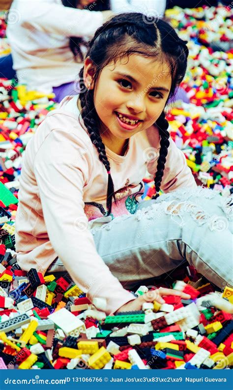 Little Girl With Educational Toy Blocks Children Play At Day Care Or