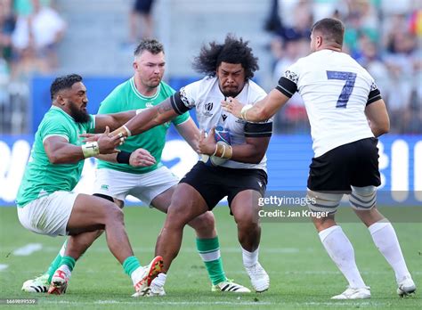 Tevita Manumua Of Romania Holds Off Bundee Aki Of Ireland During The