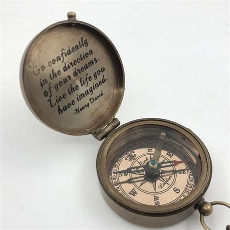 An Old Compass With A Quote On It