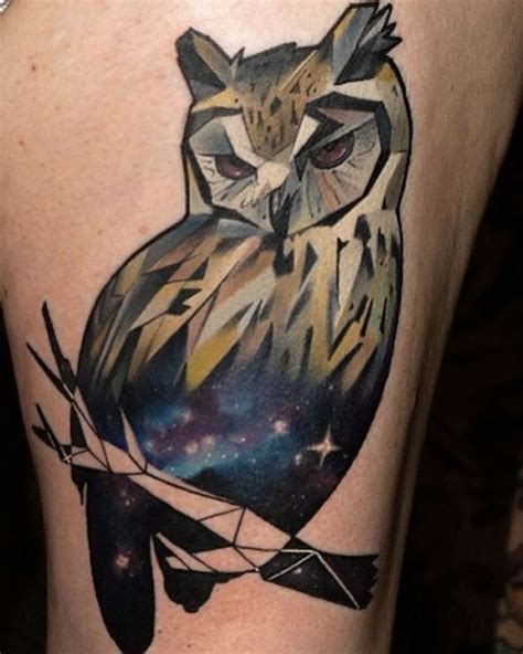 Mystical multicolored thigh tattoo of owl stylized with space - Tattooimages.biz