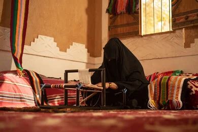 A Saudi Arab Gulf Woman Who Wears A Niqab Knits And Spins Textiles And