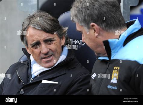 Manchester City Manager Roberto Mancini And His Assistant Brian Kidd