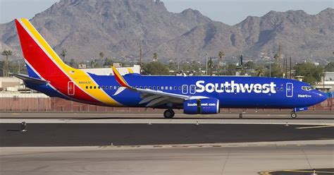 Download Southwest Airlines Parked Blue Airplane Wallpaper