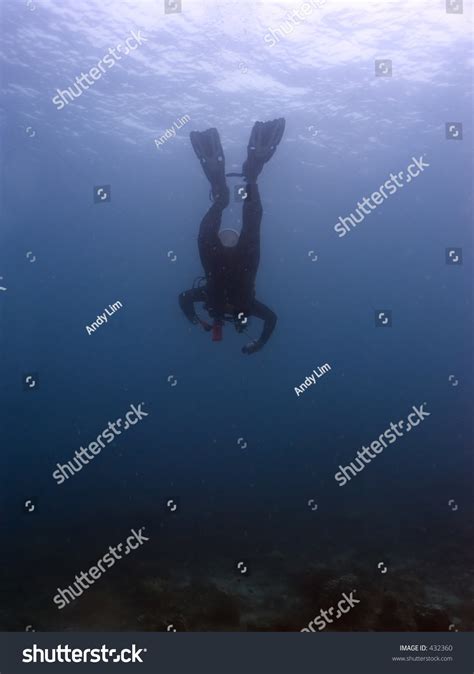 Scuba Diver Diving Head First Into The Ocean Stock Photo 432360