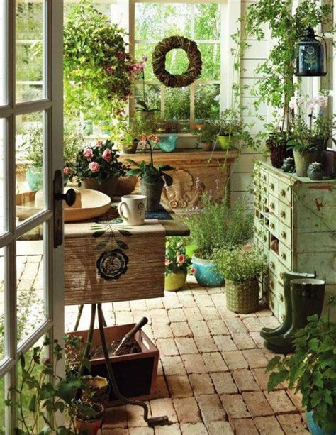 A Room Filled With Lots Of Potted Plants Next To An Open Door And Window