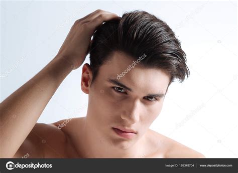 Portrait Of Confident Brunette That Posing On Camera Stock Photo