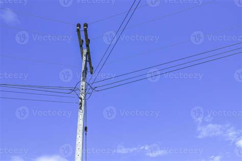 Electric poles with electric cables and power lines on a clear sky ...