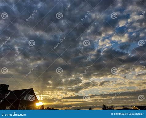 Landscape Of Horizon Sunset Behind A House In A Cloud Covered Sky With