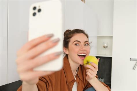 Free Photo Beautiful Young Woman Lifestyle Blogger Records Video Of Herself Takes Selfie While