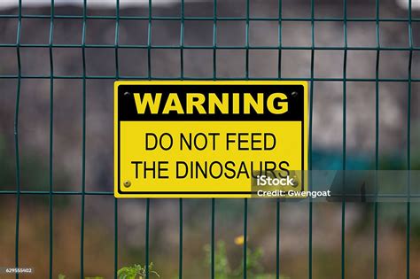 Warning Do Not Feed The Dinosaurs Stock Photo Download Image Now