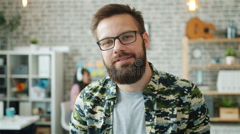 Portrait Of Businessman In Glasses Standing In Office Smiling Looking