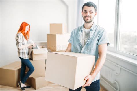 Happy Couple Unpacking Cardboard Boxes New House Stock Photo Image