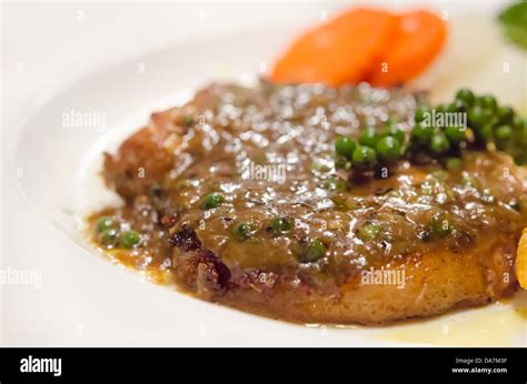 close up beef steak with green peppercorn sauce Stock Photo - Alamy