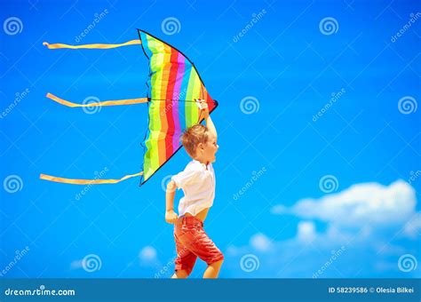 Happy Young Boy Running With Kite On Sky Background Stock Photo Image