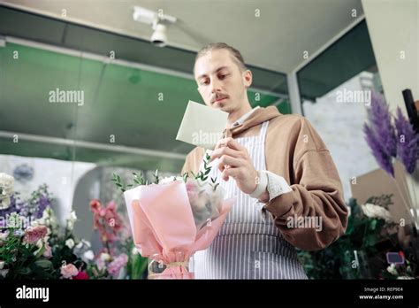 Handsome Blonde Man Reading Notes At Work Stock Photo Alamy