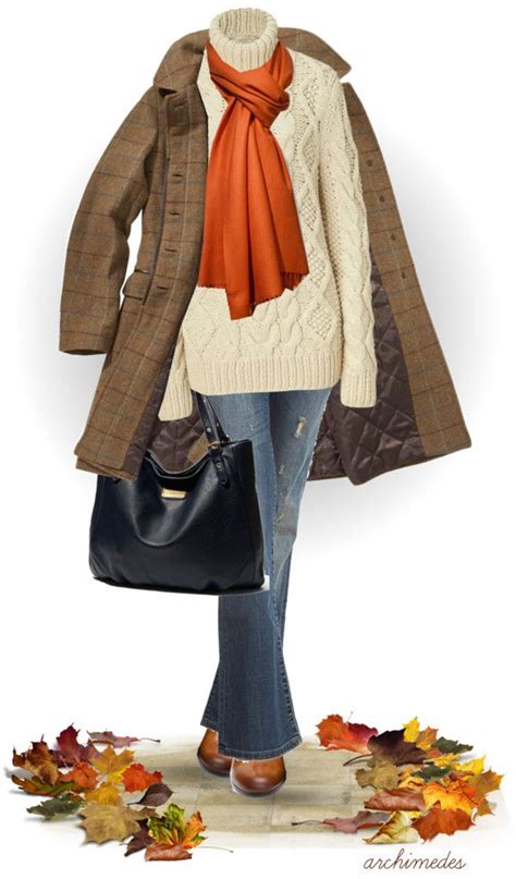 A Woman Is Carrying A Handbag And Wearing A Coat With An Orange Scarf