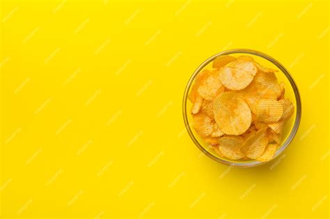 Premium Photo Potato Chips On Bowl Isolated On Colored Background Delicious Crispy Potato