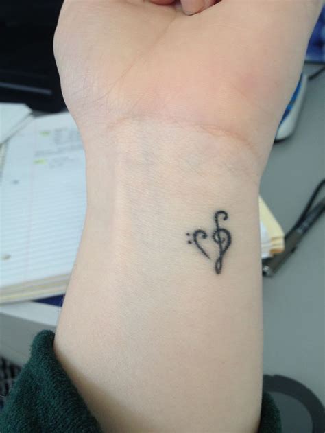 Bass Clef And Treble Clef Heart Tattoo On Wrist