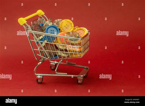 Multi Colored Buttons Of Different Shapes In A Shopping Cart Lots Of