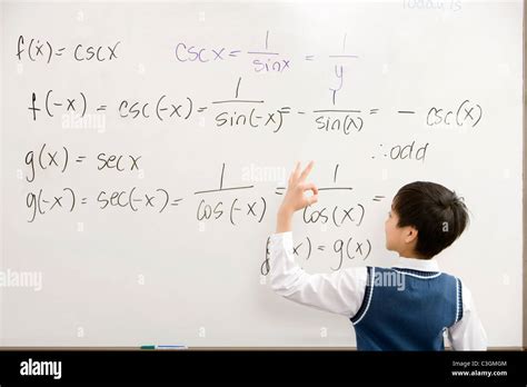 Student doing a math on the whiteboard Stock Photo - Alamy