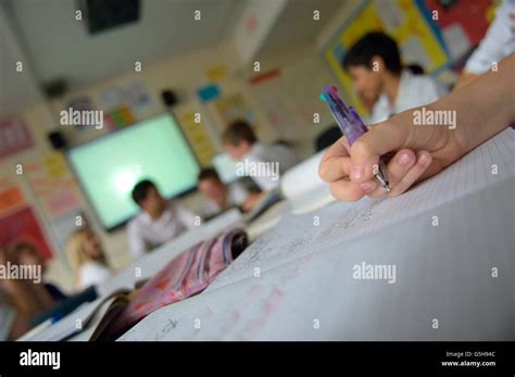 Maths Teacher In A Secondary School Classroom With Pupils England Uk