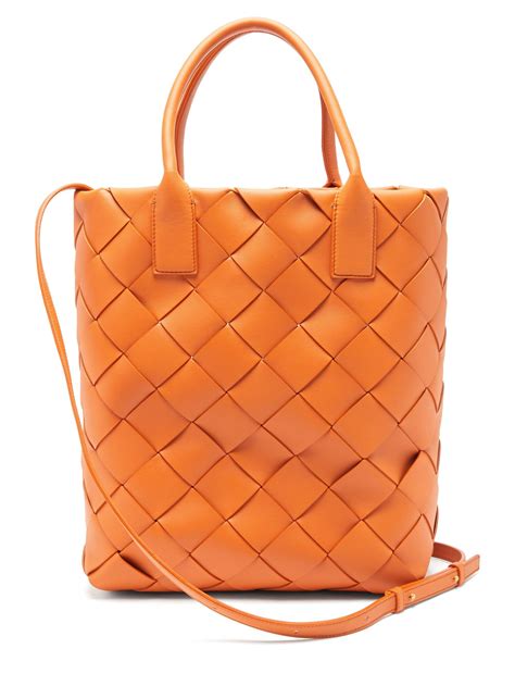 Bottega Veneta Maxi Cabat Intrecciato Leather Tote Bag In Orange Lyst