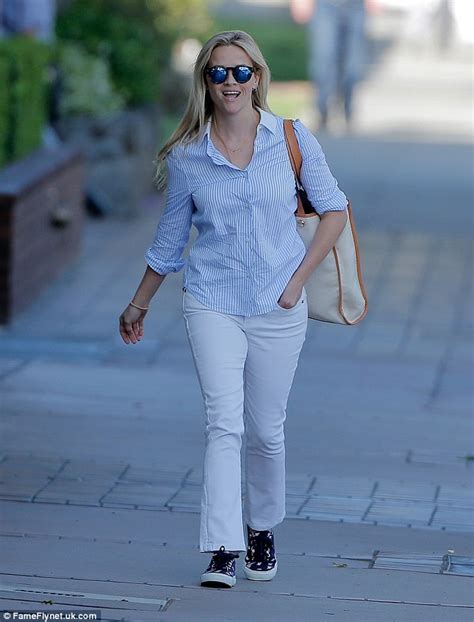 Reese Witherspoon Dresses Her Slim Frame In A Crisp Shirt And White