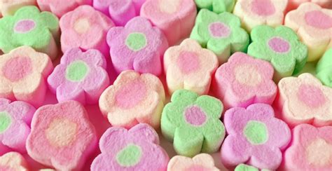 Rows Of Pastel Pink And Green Flower Shaped Marshmallow Candies For