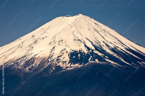 Snow capped peak of Mt. Fuji, symbol of Japan Stock Photo | Adobe Stock