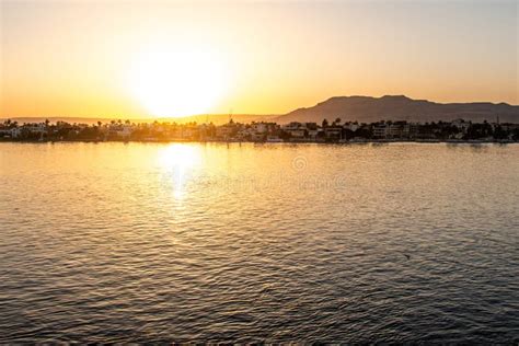 View of the Nile River with Sailboats at Golden Colorful Sunset in ...