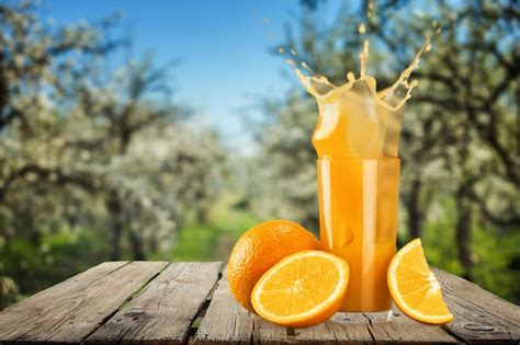 Premium Photo Glass Of Delicious Orange Juice On Natural Background