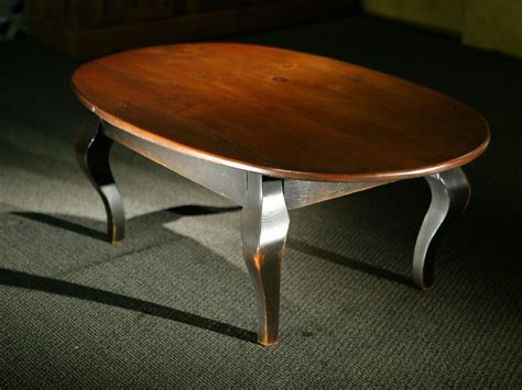 Oval Wood Coffee Table with Black French Legs | Coffee table wood, Oval wood coffee table ...