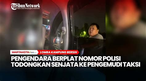 Pengendara Berplat Nomor Polisi Todongkan Senjata Ke Pengemudi Taksi