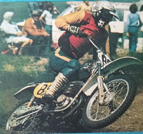 A Man Riding On The Back Of A Dirt Bike